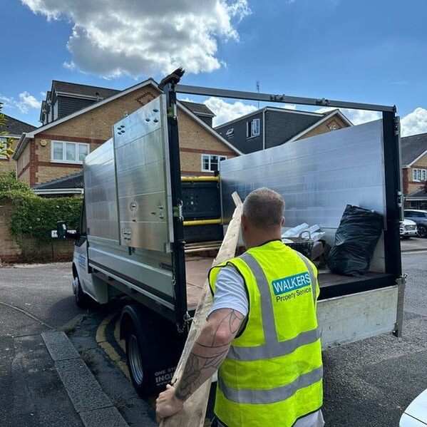 Walkers Waste team loading a tipper van